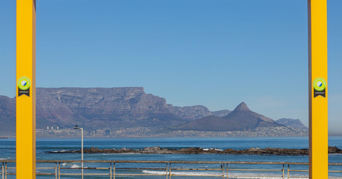 Framed view of Table Mountain and Atlantic Ocean in Cape Town, South Africa.